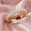 Shared prong setting full eternity diamond wedding band in 18kt yellow gold with round brilliant lab-grown diamonds.