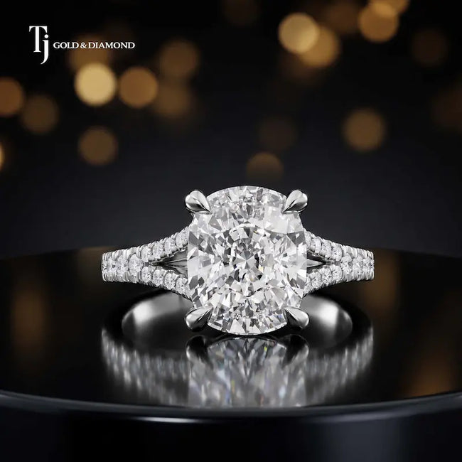 Front view of a cushion cut split shank lab-grown diamond engagement ring in 18kt white gold.