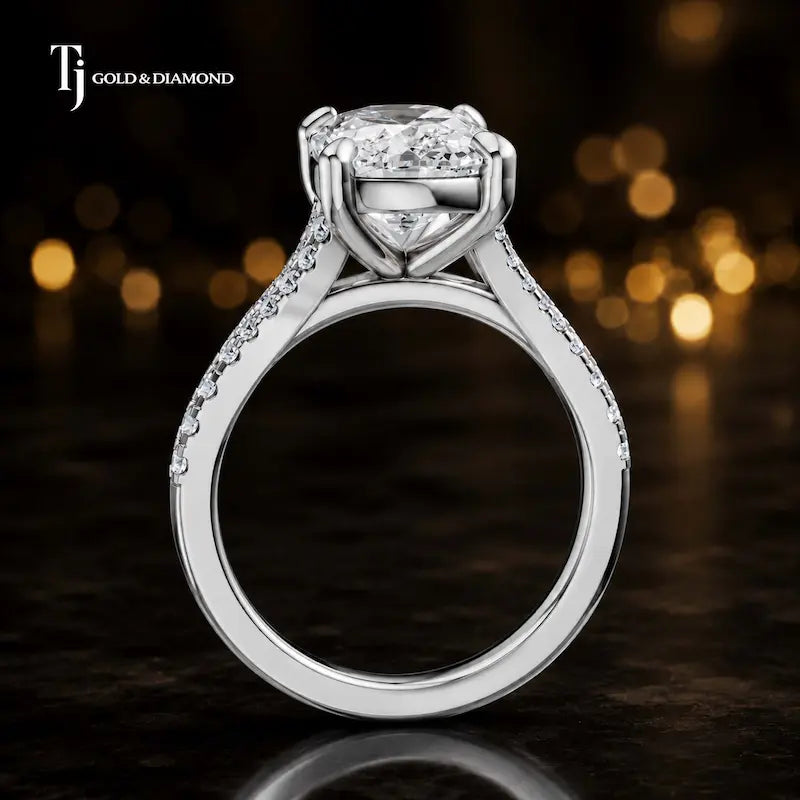 Side view of a cushion cut split shank lab-grown diamond engagement ring featuring a four-claw cathedral setting in 18kt white gold.
