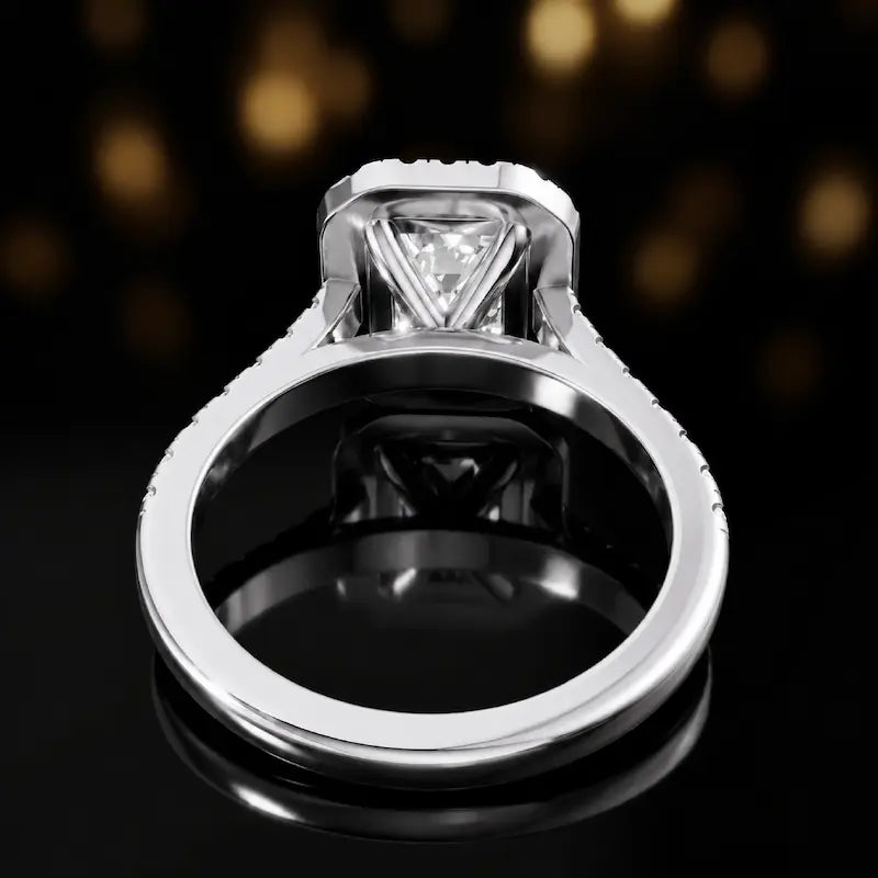 Rear view of an emerald cut halo lab-grown diamond engagement ring in 18kt white gold.