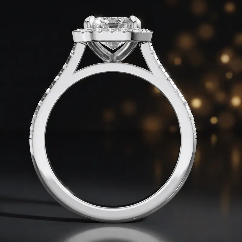 Side view of an emerald cut halo lab-grown diamond engagement ring in 18kt white gold.