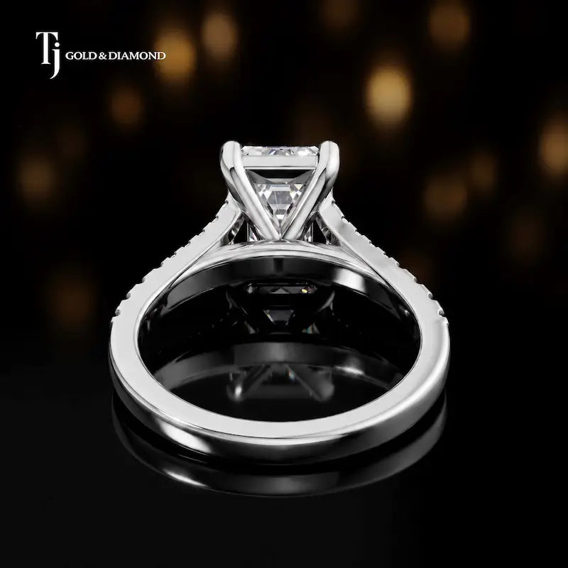 Back view of an emerald cut split shank lab-grown diamond engagement ring in 18kt white gold.