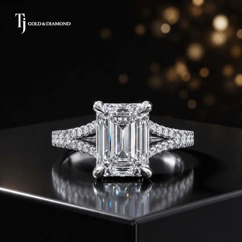 Front view of an emerald cut split shank lab-grown diamond engagement ring in 18kt white gold.