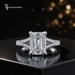 Front view of an emerald cut split shank lab-grown diamond engagement ring in 18kt white gold.