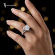 Heart cut split shank lab-grown diamond engagement ring worn on hand in 18kt white gold.