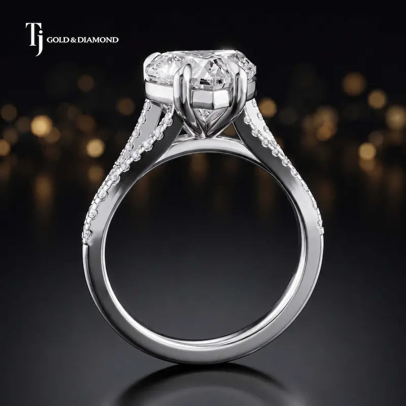 Side view of a heart cut split shank lab-grown diamond engagement ring featuring a four-claw cathedral setting in 18kt white gold.