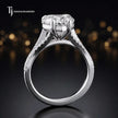 Side view of a heart cut split shank lab-grown diamond engagement ring featuring a four-claw cathedral setting in 18kt white gold.