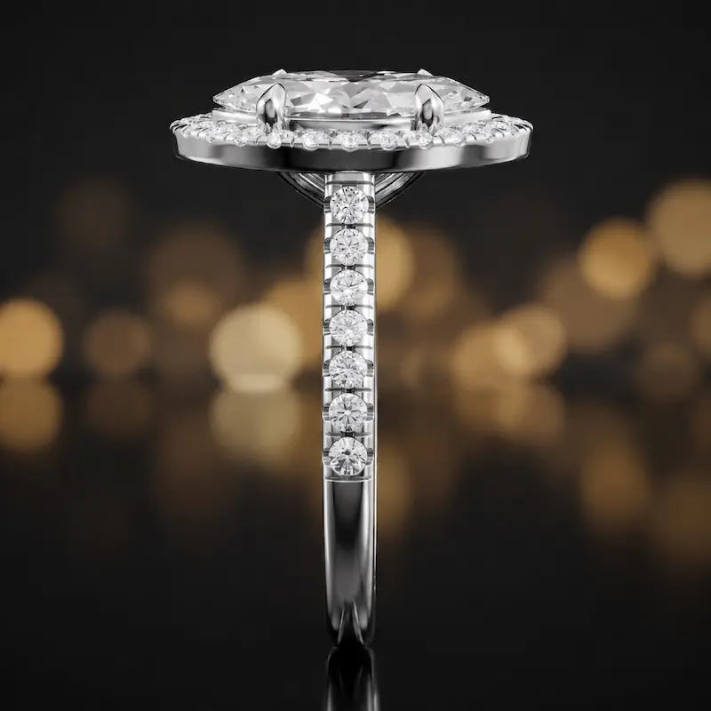Side profile of a marquise cut halo lab-grown diamond engagement ring in 18kt white gold.