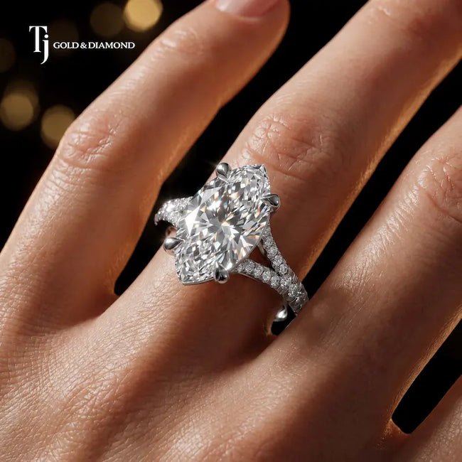 Marquise cut split shank lab-grown diamond engagement ring worn on hand in 18kt white gold.
