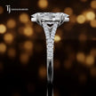 Side profile of a marquise cut split shank lab-grown diamond engagement ring with diamond-set shoulders in 18kt white gold.