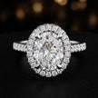 Front view of an oval cut halo lab-grown diamond engagement ring in 18kt white gold.
