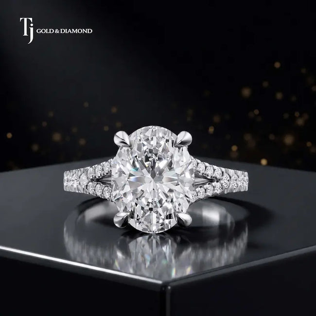 Front view of an oval cut split shank lab-grown diamond engagement ring in 18kt white gold.