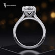 Side view of a radiant cut split shank lab-grown diamond engagement ring featuring a four-claw cathedral setting in 18kt white gold.