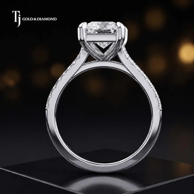Side view of a radiant cut split shank lab-grown diamond engagement ring featuring a four-claw cathedral setting in 18kt white gold.