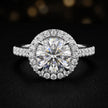 Front view of a round cut halo lab-grown diamond engagement ring in 18kt white gold.