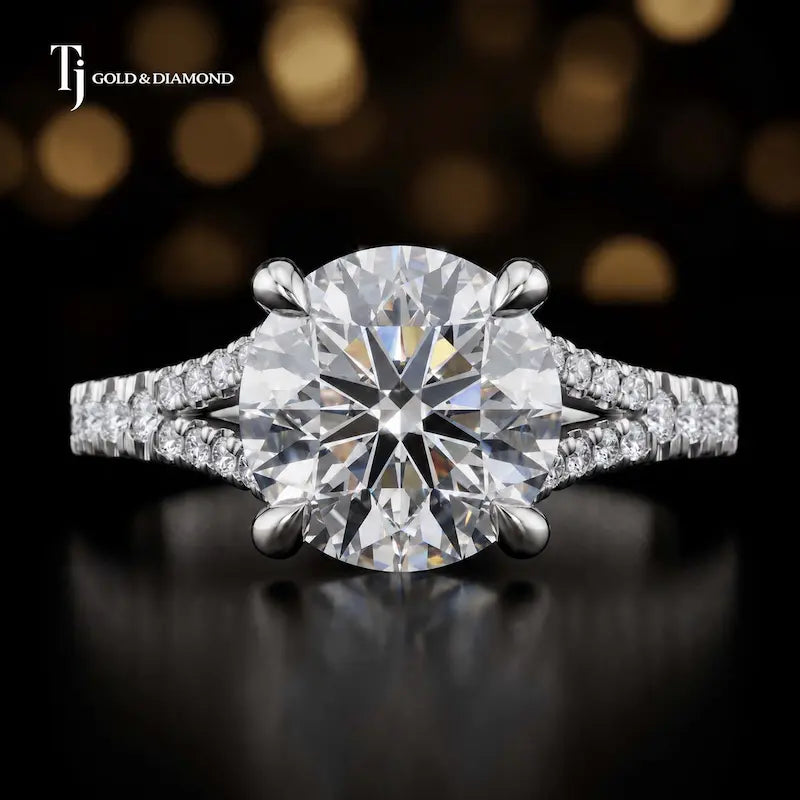 Front view of a round cut split shank lab-grown diamond engagement ring in 18kt white gold.