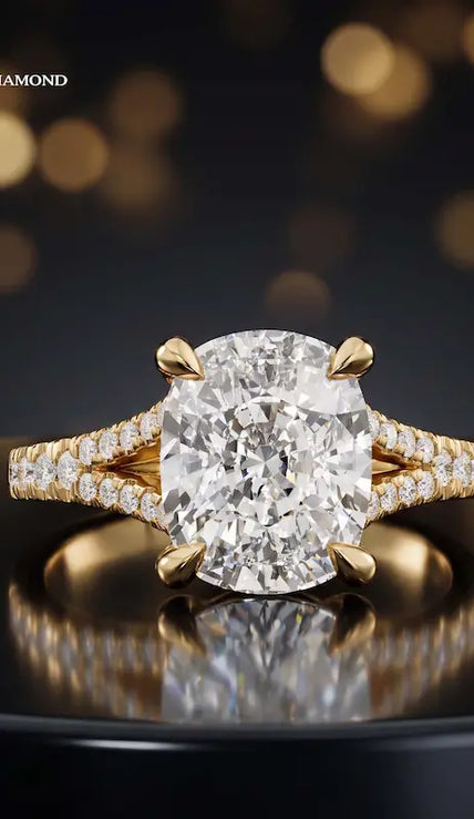 Front view of a cushion cut split shank lab-grown diamond engagement ring in 18kt yellow gold.
