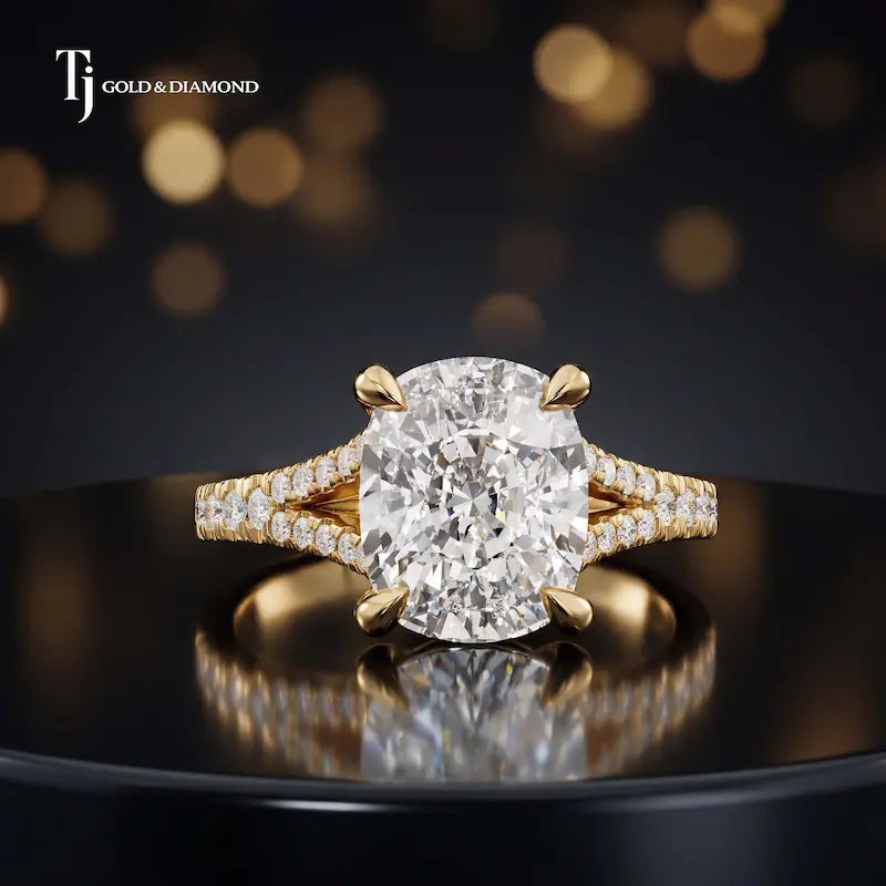 Front view of a cushion cut split shank lab-grown diamond engagement ring in 18kt yellow gold.