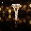 Side profile of a cushion cut split shank lab-grown diamond engagement ring with diamond-set shoulders in 18kt yellow gold.