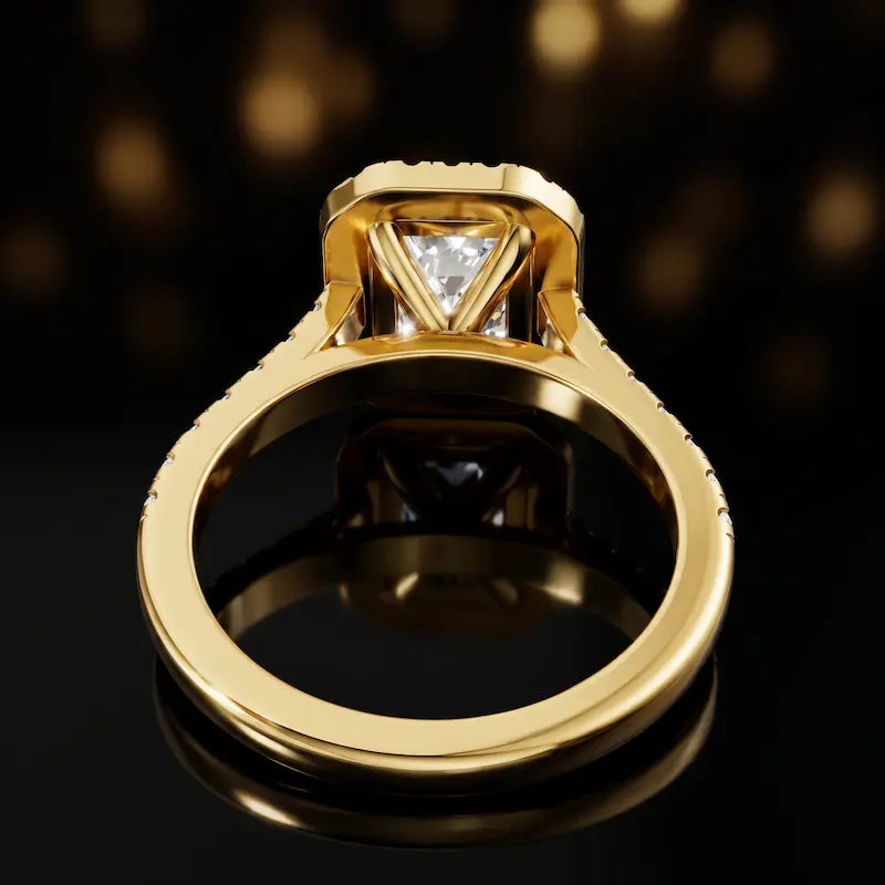 Rear view of an emerald cut halo lab-grown diamond engagement ring in 18kt yellow gold.