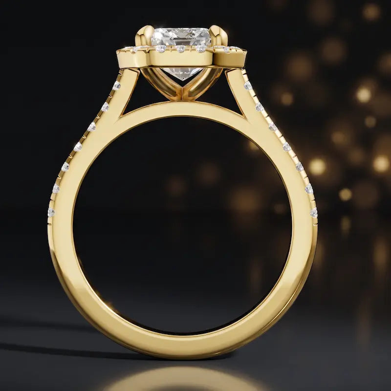 Side view of an emerald cut halo lab-grown diamond engagement ring in 18kt yellow gold.