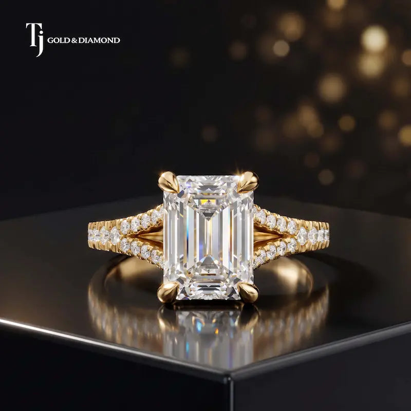 Front view of an emerald cut split shank lab-grown diamond engagement ring in 18kt yellow gold.