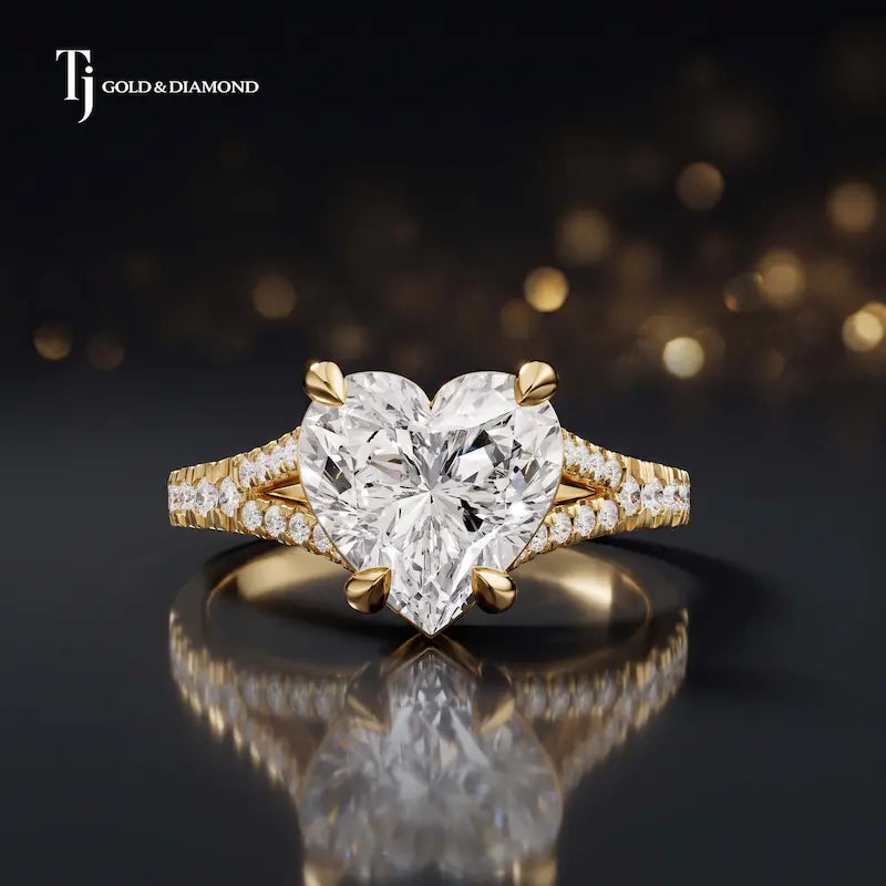 Front view of a heart cut split shank lab-grown diamond engagement ring in 18kt yellow gold.