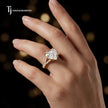 Heart cut split shank lab-grown diamond engagement ring worn on hand in 18kt yellow gold.