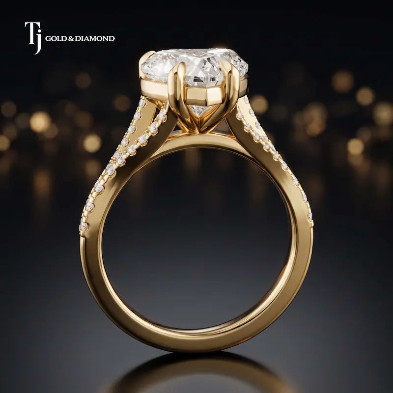 Side view of a heart cut split shank lab-grown diamond engagement ring featuring a four-claw cathedral setting in 18kt yellow gold.