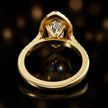 Rear view of a marquise cut halo lab-grown diamond engagement ring in 18kt yellow gold.