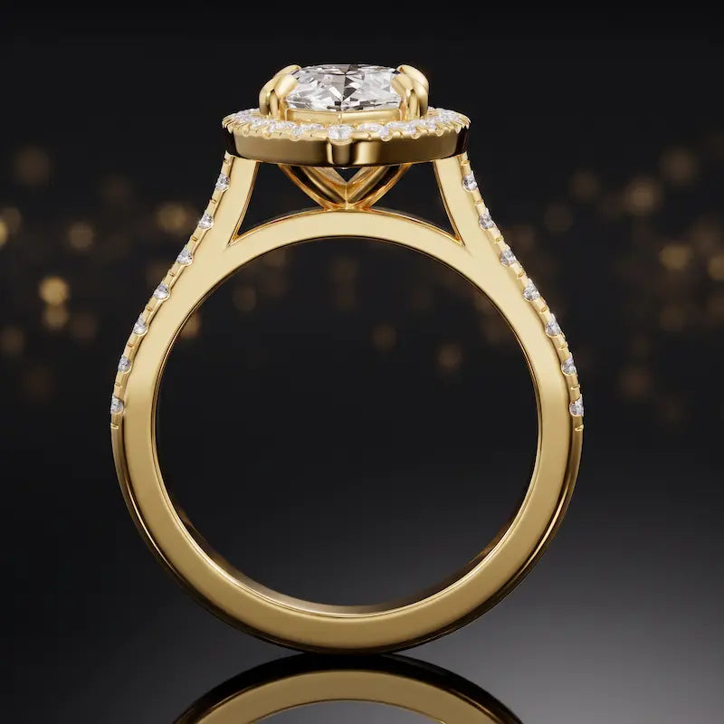 Side view of a marquise cut halo lab-grown diamond engagement ring with diamond-set shoulders in 18kt yellow gold.