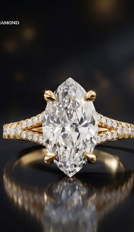 Front view of a marquise cut split shank lab-grown diamond engagement ring in 18kt yellow gold.
