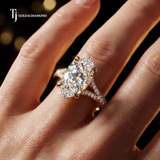 Marquise cut split shank lab-grown diamond engagement ring worn on hand in 18kt yellow gold.