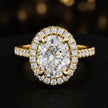 Front view of an oval cut halo lab-grown diamond engagement ring in 18kt yellow gold.
