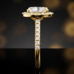 Side profile of an oval cut halo lab-grown diamond engagement ring in 18kt yellow gold.