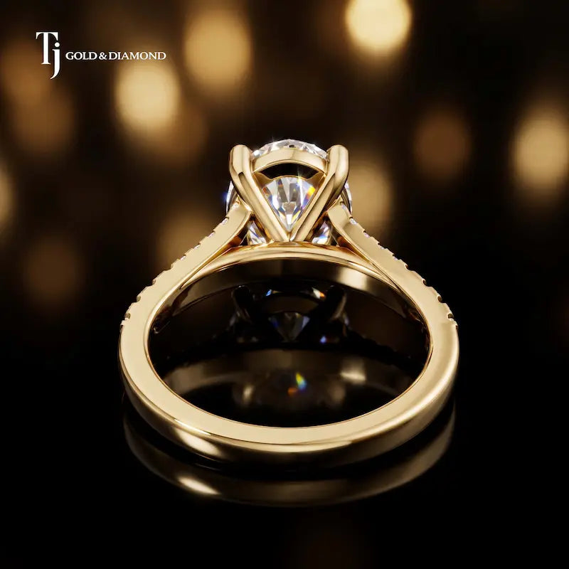 Back view of an oval cut split shank lab-grown diamond engagement ring in 18kt yellow gold.