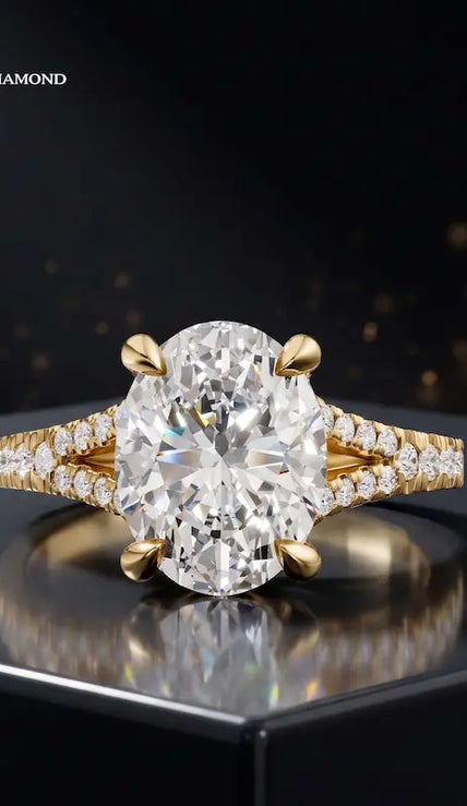 Front view of an oval cut split shank lab-grown diamond engagement ring in 18kt yellow gold.