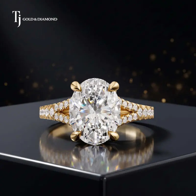 Front view of an oval cut split shank lab-grown diamond engagement ring in 18kt yellow gold.