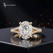 Front view of an oval cut split shank lab-grown diamond engagement ring in 18kt yellow gold.