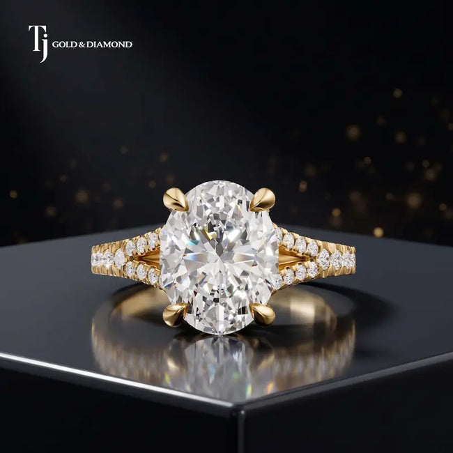 Front view of an oval cut split shank lab-grown diamond engagement ring in 18kt yellow gold.