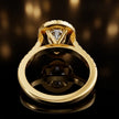 Rear view of a pear cut halo lab-grown diamond engagement ring in 18kt yellow gold.