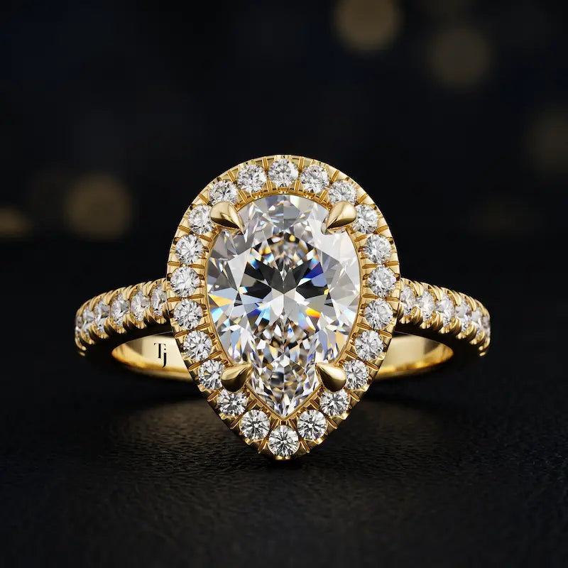 Front view of a pear cut halo lab-grown diamond engagement ring in 18kt yellow gold.