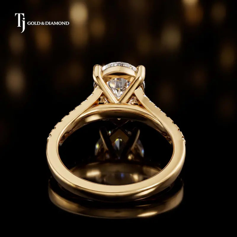 Back view of a pear cut split shank lab-grown diamond engagement ring in 18kt yellow gold.