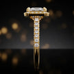Side profile of a princess cut halo lab-grown diamond engagement ring in 18kt yellow gold.
