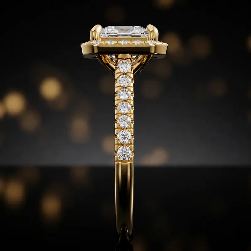 Side profile of a princess cut halo lab-grown diamond engagement ring in 18kt yellow gold.