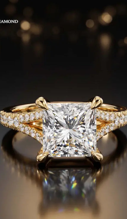 Front view of a princess cut split shank lab-grown diamond engagement ring in 18kt yellow gold.