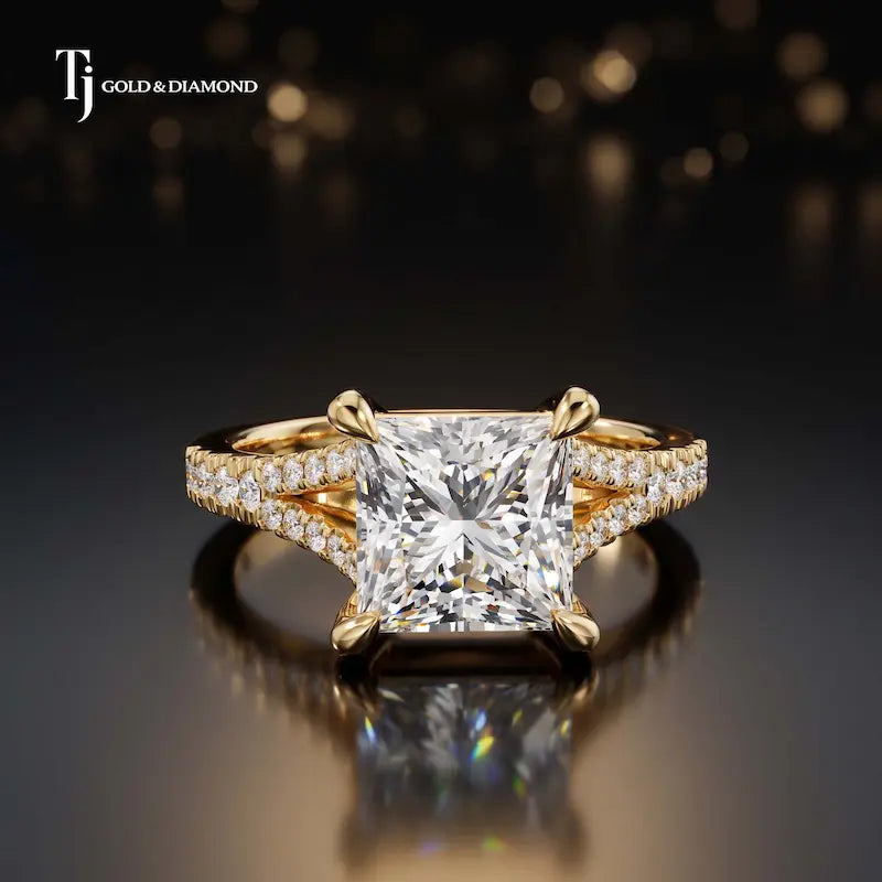 Front view of a princess cut split shank lab-grown diamond engagement ring in 18kt yellow gold.