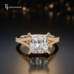 Front view of a princess cut split shank lab-grown diamond engagement ring in 18kt yellow gold.