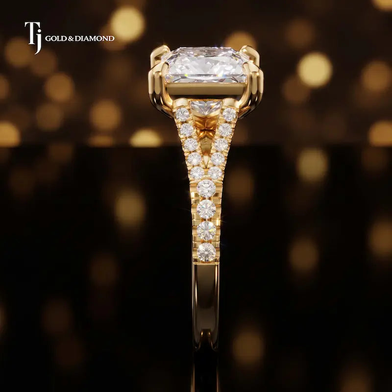 Side profile of a princess cut split shank lab-grown diamond engagement ring with diamond-set shoulders in 18kt yellow gold.