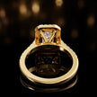 Rear view of a radiant cut halo lab-grown diamond engagement ring in 18kt yellow gold.